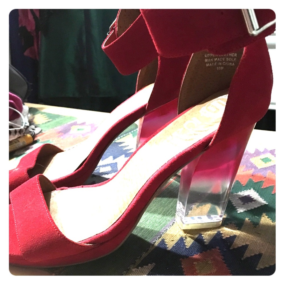 Sexy Jeffrey Campbell red with clear heel shoe.
